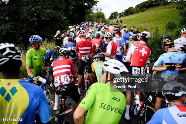 The peloton stopped as the race is temporarily interrupted by protesters during the 96th UCI Cycling World Championships Glasgow 2023, Men Elite Road...