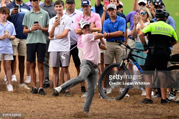 Justin Thomas of the United States plays a shot on the 18th hole during the final round of the Wyndham Championship at Sedgefield Country Club on...