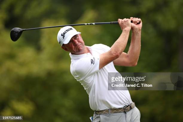 Lucas Glover of the United States plays his shot from the 14th tee during the final round of the Wyndham Championship at Sedgefield Country Club on...