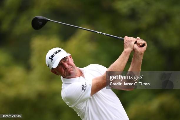Lucas Glover of the United States plays his shot from the 14th tee during the final round of the Wyndham Championship at Sedgefield Country Club on...
