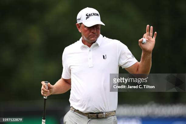 Lucas Glover of the United States reacts on the 14th green during the final round of the Wyndham Championship at Sedgefield Country Club on August...