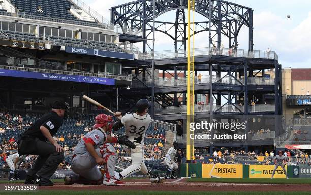 Henry Davis of the Pittsburgh Pirates hits a run scoring sacrifice fly ball in the first inning during game two of a doubleheader against the...