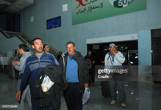 Freed Algerian hostages arrive at Algiers airport after they were released by Islamist captors, alongside other Algerians, from a gas plant in In...