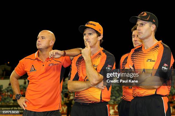 Herschelle Gibbs, Brad Hogg and Simon Katich of the Scorchers look on after being defeated during the Big Bash League final match between the Perth...