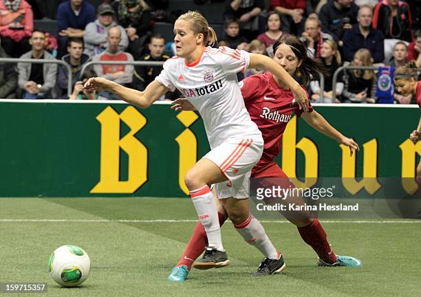 Vanessa Buerki of FC Bayern Muenchen challenges Sylvia Arnold of SC Freiburg 1904 during the DFB Women's Indoor Cup 2013 at the GETEC-Arena on...