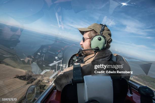 pilot in flight - propeller airplane stock pictures, royalty-free photos & images