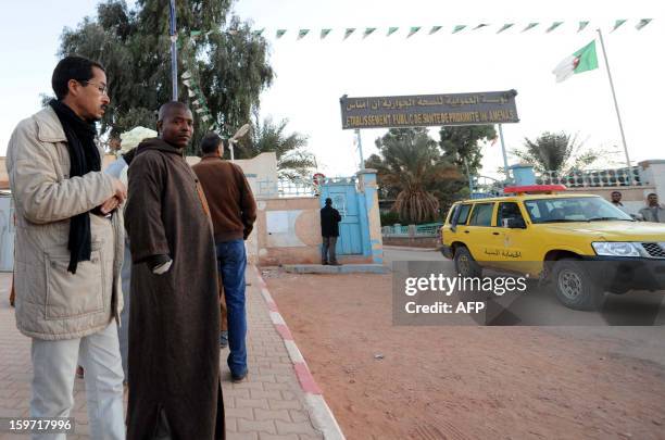 Algerians gather outside a hospital in In Amenas deep in the Sahara near the Libyan border on January 19, 2013. Islamist gunmen killed seven foreign...