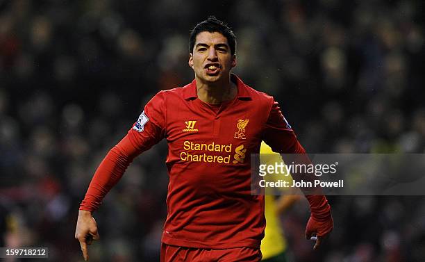 Luis Suarez of Liverpool celebrates after scoring his team's second goal during the Barclays Premier League match between Liverpool and Norwich City...