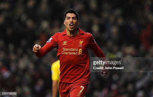 Luis Suarez of Liverpool celebrates his first goal during the Barclays Premier League match between Liverpool and Norwich City at Anfield on January...