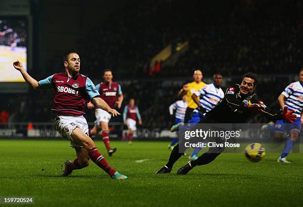 Joe Cole of West Ham United has a shot blocked by Julio Cesar the Queens Park Rangers goalkeeper during the Barclays Premier League match between...