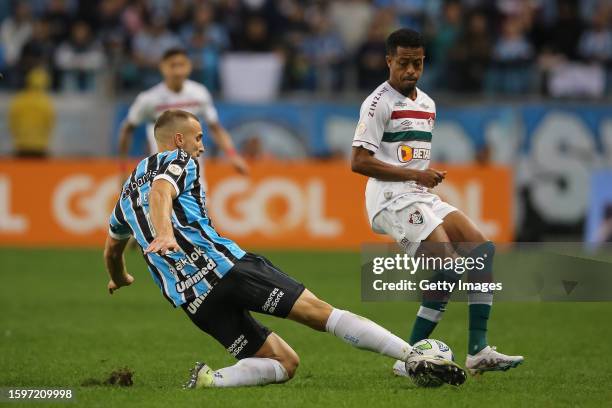 Rodrigo Ely of Gremio fights for the ball with Keno of Fluminense during a match between Gremio and Fluminense as part of Brasileirao 2023 at Arena...