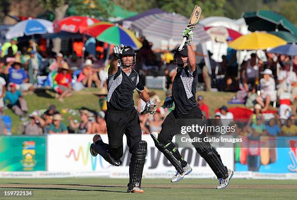 James Franklin of New Zealand celebrates hitting the winning runs next to Mitchell McClenaghan during the 1st One Day International match between...