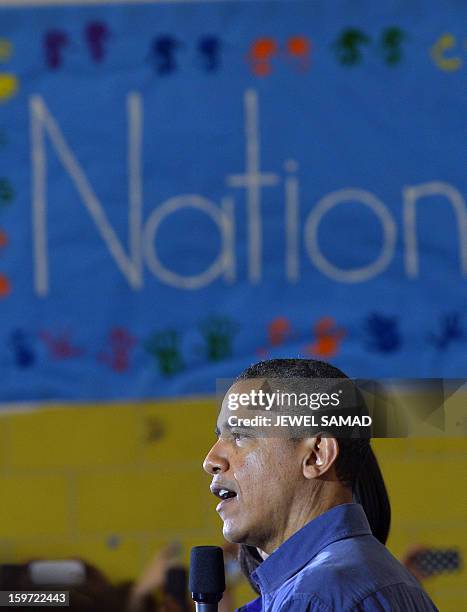 President Barack Obama speaks to a crowd at Burrville Elementary School after participating in National Day of Service on January 19, 2013 in...