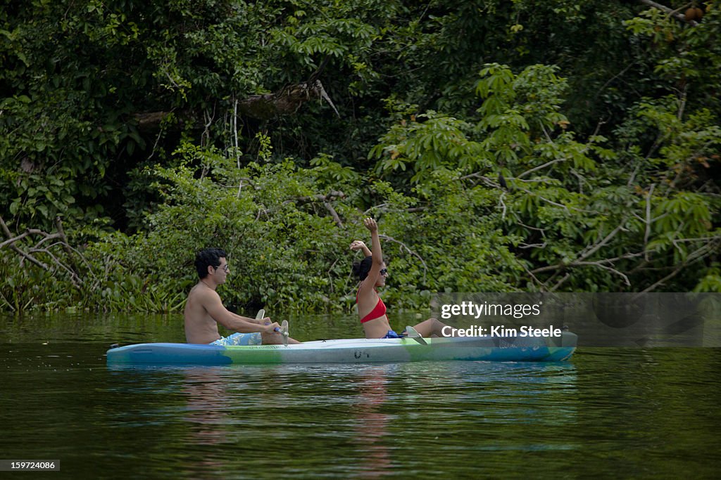 Romantic couple kayaking, Catemaco Lake, Mexico