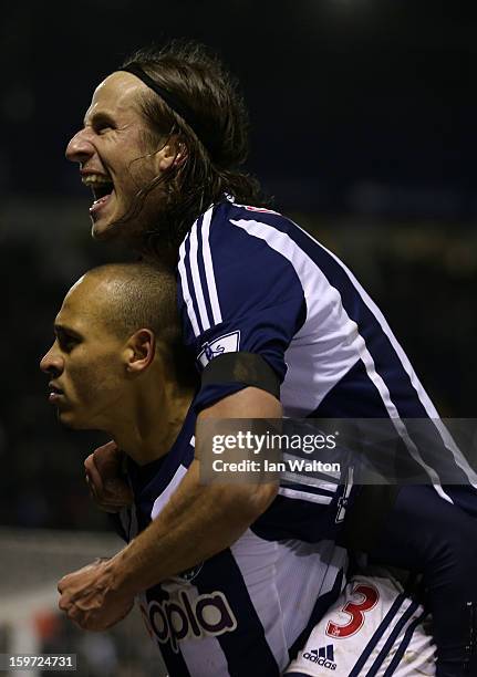 Peter Odemwingie of West Bromwich Albion celebrates scoring their second goal with Jonas Olsson of West Bromwich Albion during the Barclays Premier...