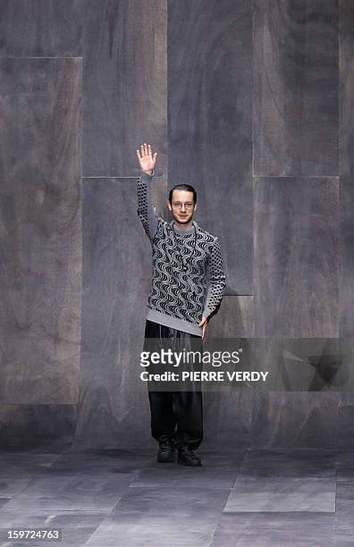 Croatian designer Damir Doma acknowledges the audience at the end of the men's Fall-Winter 2013-2014 collection show on January 19, 2013 as part of...