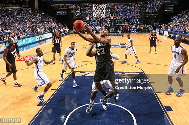 Wesley Saunders of the Harvard Crimson drives to the basket for a layup against the Memphis Tigers on January 19, 2013 at FedExForum in Memphis,...