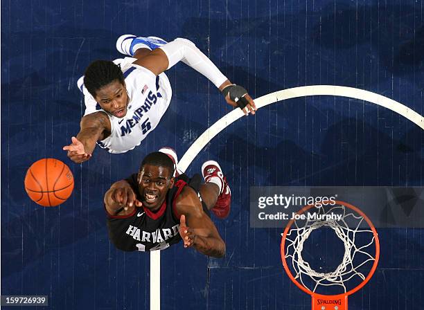 Shaq Goodwin of the Memphis Tigers jumps for the ball against Steve Moundou-Missi of the Harvard Crimson on January 19, 2013 at FedExForum in...