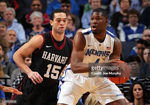 Adonis Thomas of the Memphis Tigers looks to pass against Christian Webster of the Harvard Crimson on January 19, 2013 at FedExForum in Memphis,...