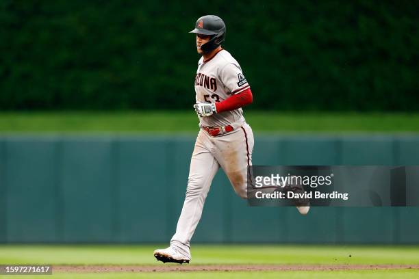 Christian Walker of the Arizona Diamondbacks rounds the bases after hitting a solo home run against the Minnesota Twins in the ninth inning at Target...