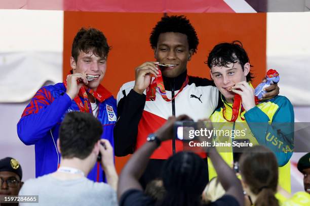 Silver Medallist, James Allison of Team Cayman Islands, Gold Medallist, Nikoli Blackman of Team Trinidad & Tobago and Bronze Medallist, Harvey Larke...