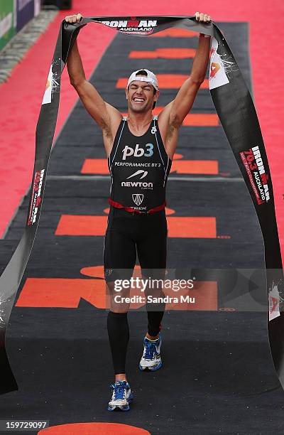 Christian Kemp of Australia celebrates winning during the Ironman 70.3 Auckland triathlon on January 20, 2013 in Auckland, New Zealand.