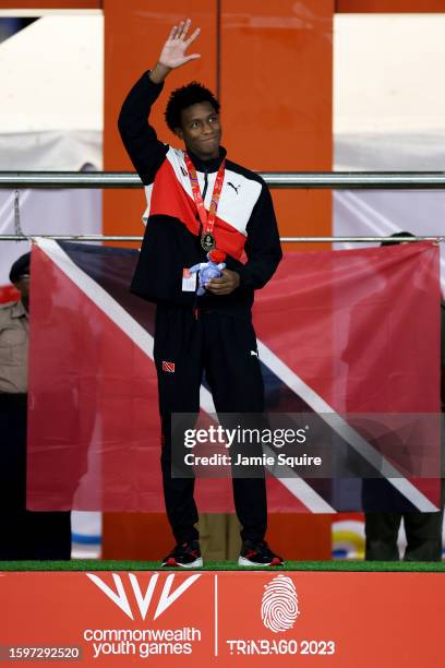 Gold Medallist, Nikoli Blackman of Team Trinidad & Tobago celebrates on the podium after the Men's 200m Freestyle Final on day two of the 2023 Youth...