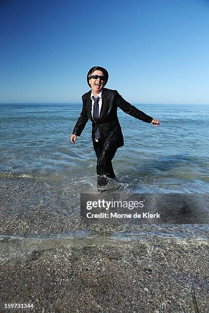 Woman leaves the water after taking part in an art installation created by surrealist artist Andrew Baines on January 20, 2013 in Adelaide, Australia.