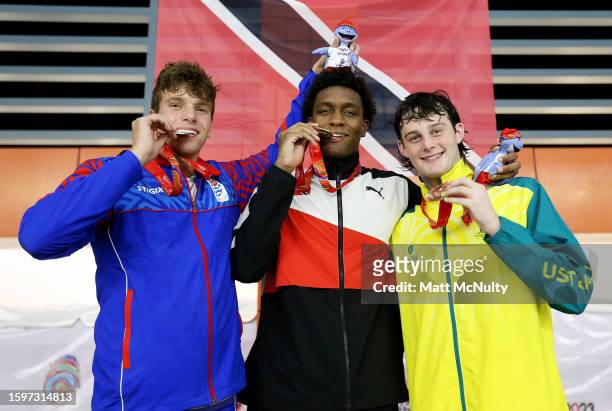 Silver Medallist, James Allison of Team Cayman Islands, Gold Medallist, Nikoli Blackman of Team Trinidad & Tobago and Bronze Medallist, Harvey Larke...