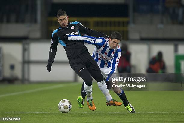 Everton Ramos da Silva of Heracles Almelo, Christian Kum of sc Heerenveen during the Dutch Eredivise match between SC Heerenveen and Heracles Almelo...