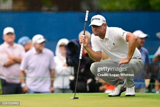 Lucas Glover of the United States lines up a putt on the 17th green during the final round of the Wyndham Championship at Sedgefield Country Club on...