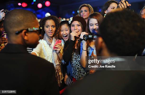 People yell as they see musicans Mindless Behavior as they attend the children's concert at the Washington Convention Center to celebrate military...