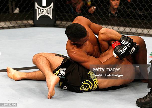 Yuri Alcantara attempts a shoulder lock submission against Pedro Nobre in their bantamweight fight at the UFC on FX event on January 19, 2013 at...