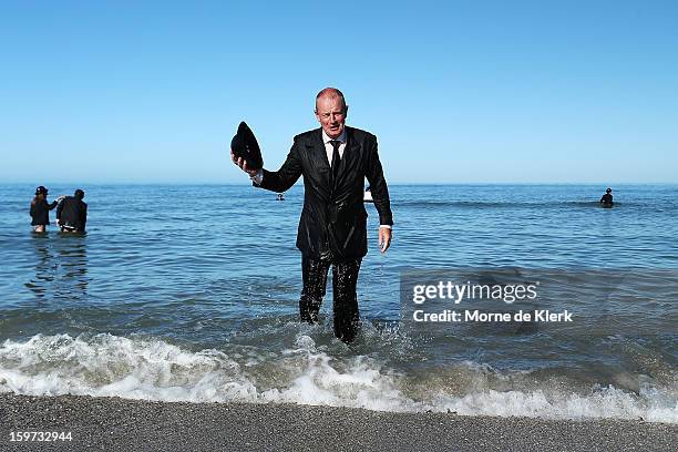 Man leaves the water after taking part in an art installation created by surrealist artist Andrew Baines on January 20, 2013 in Adelaide, Australia.