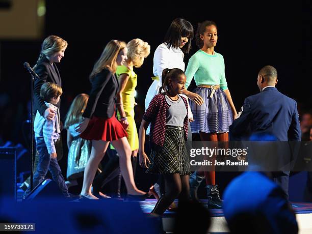 The First Lady Michelle Obama and her children along with Jill Biden and her family arrive for the children's concert at the Washington Convention...