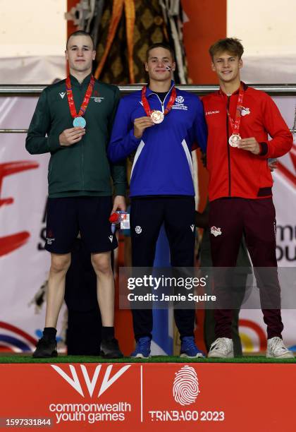 Silver Medallist, Brandon Biss of Team Northern Ireland, Gold Medallist, Matthew Ward and Bronze Medallist, Adam Graham of Team England stand on the...
