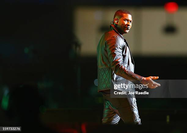 The musician Usher sings during the children's concert at the Washington Convention Center to celebrate military families on January 19, 2013 in...