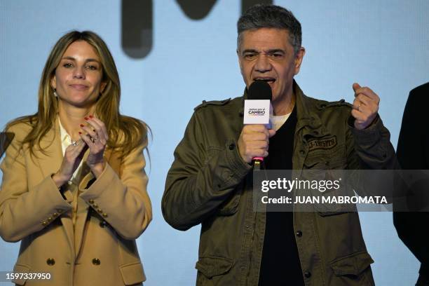 Chief of Government of the City of Buenos Aires pre-candidate Jorge Macri speaks next to his partner Maria Belen Ludueña after defeating...