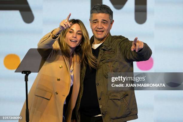 Chief of Government of the City of Buenos Aires pre-candidate Jorge Macri celebrates with his partner Maria Belen Ludueña after defeating...