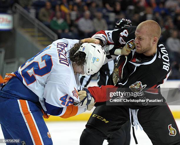 Brandon DeFazio of the Bridgeport Sound Tigers and Ben Blood of the Binghamton Senators fight during an American Hockey League game on January 19,...