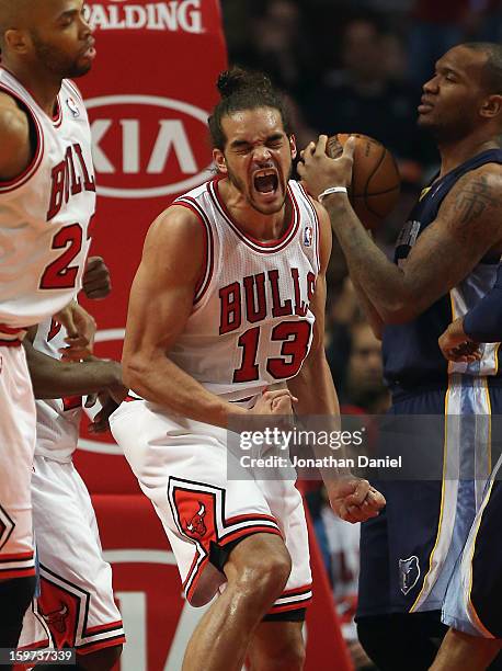 Joakim Noah of the Chicago Bulls celebrates a dunk against the Memphis Grizzles at the United Center on January 19, 2013 in Chicago, Illinois. NOTE...