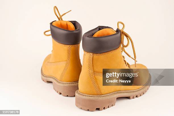 yellow boots - wanderschuhe freisteller stock-fotos und bilder