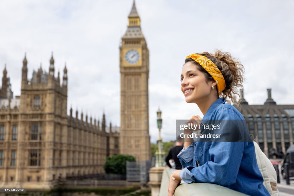 Happy tourist in London looking at the view near the Big Ben