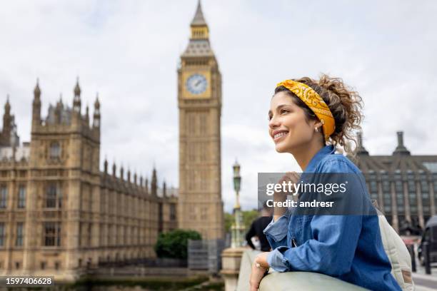 happy tourist in london looking at the view near the big ben - tourist stock pictures, royalty-free photos & images