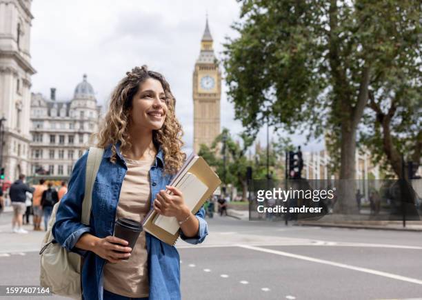 exchange student walking outdoors in london and drinking coffee - english language bildbanksfoton och bilder
