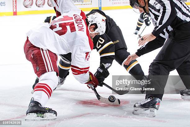 Boyd Gordon of the Phoenix Coyotes takes a face off against Cody Eakin of the Dallas Stars at the American Airlines Center on January 19, 2013 in...
