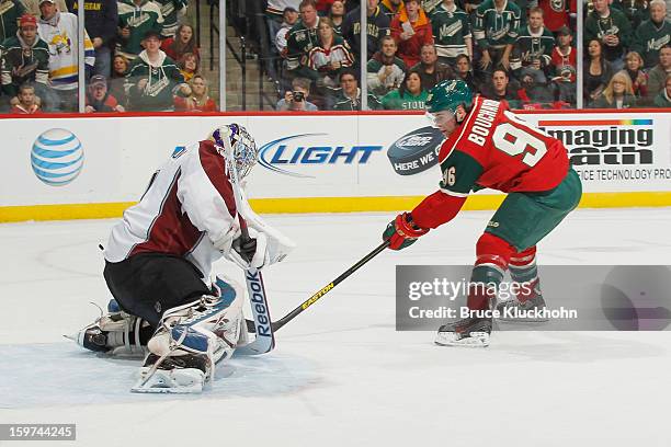 Pierre-Marc Bouchard of the Minnesota Wild is stopped n a breakaway attempt by Semyon Varlamov of the Colorado Avalanche during the game on January...