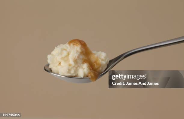 mashed potatoes and gravy - baby spoon stock pictures, royalty-free photos & images