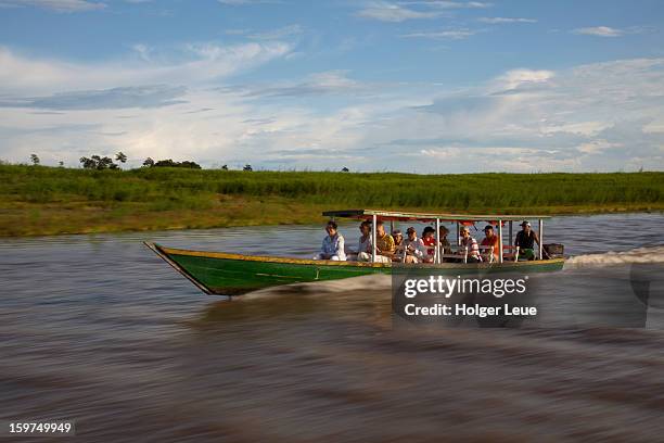 boat excursion on side arm of amazon river - manaus stock pictures, royalty-free photos & images