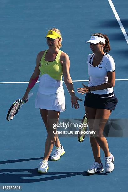 Iva Majoli of Croatia and Barbara Schett of Austria compete in their third round legends doubles match against Martina Hingis of Switzerland and...